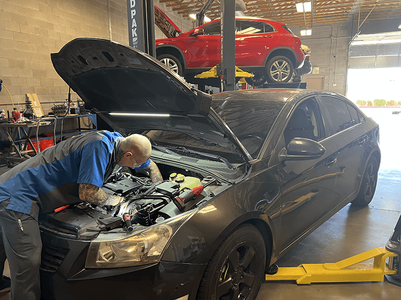 Under-hood repair work at Auto Care Experts
