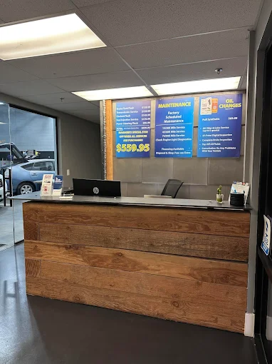Front desk and service menu at Auto Care Experts